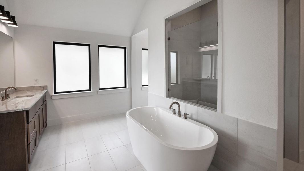 Unfurnished bedroom featuring carpet flooring, lofted ceiling, and baseboards