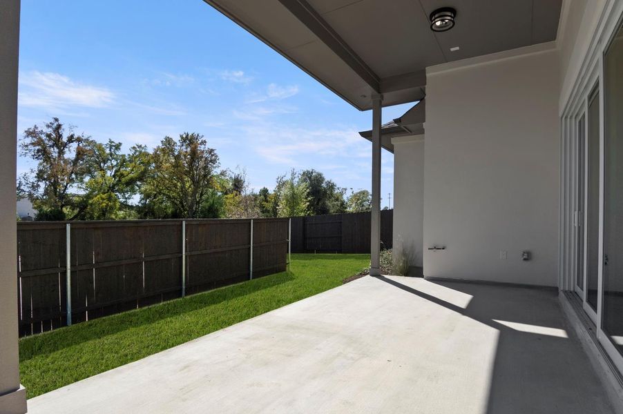 Fenced backyard with a patio Fenced backyard with a patio