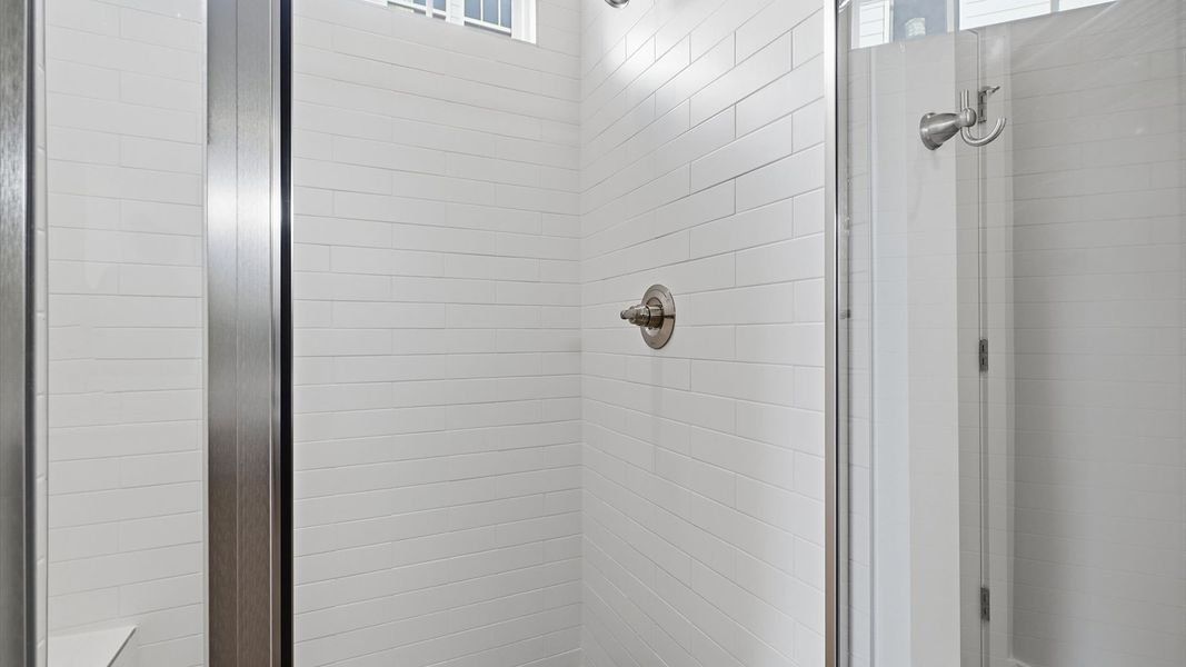 Notable primary bath featuring a spacious walk-in shower and tasteful design touches throughout in Seneca, SC