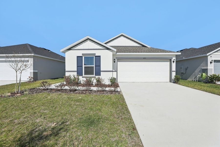 Front exterior of a new home in Robins Run, Lake Wales, FL, highlighting curb appeal (Image 2). Front exterior of a new home in Robins Run, Lake Wales, FL, highlighting curb appeal (Image 2).