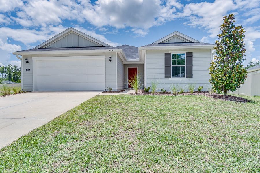 Front exterior of a new home in Anabelle Island - Executive Series, Green Cove Springs, FL, highlighting curb appeal (Image 1).