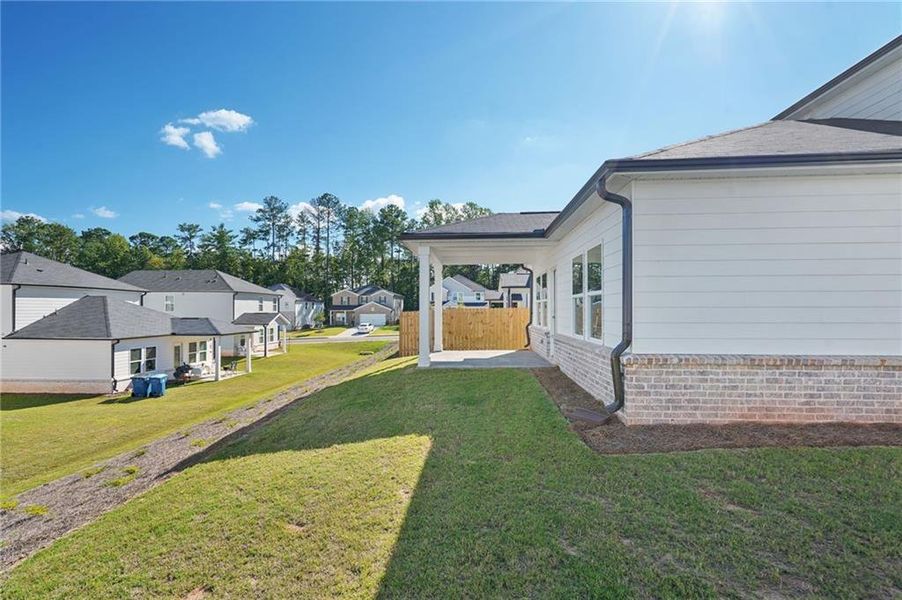 Front exterior of a new home in Martin Springs - Reserve Series, Lawrenceville, GA, highlighting curb appeal (Image 18). Front exterior of a new home in Martin Springs - Reserve Series, Lawrenceville, GA, highlighting curb appeal (Image 18).