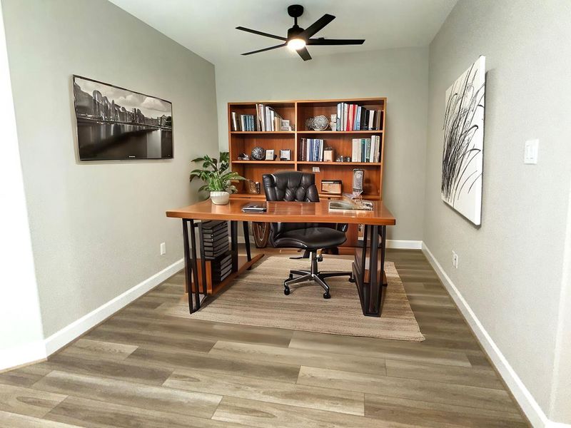 The second-floor flex space offers versatile living options—perfect for a home office, media room, play area, or additional lounge. Image depicts home as-is virtually staged.