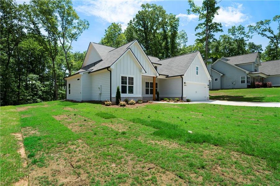 Front exterior of a new home in , Dallas, GA, highlighting curb appeal (Image 14).