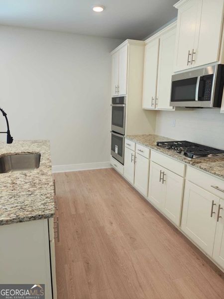 Furnished interior view inside a new home in The Fairways at Mirror Lake, Villa Rica (Image 5).