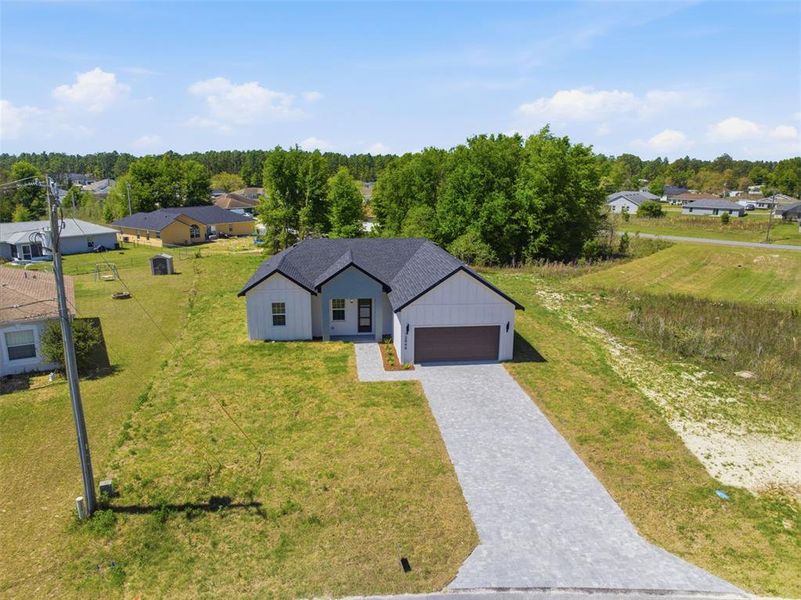 Front exterior of a new home in , Ocala, FL, highlighting curb appeal (Image 22).