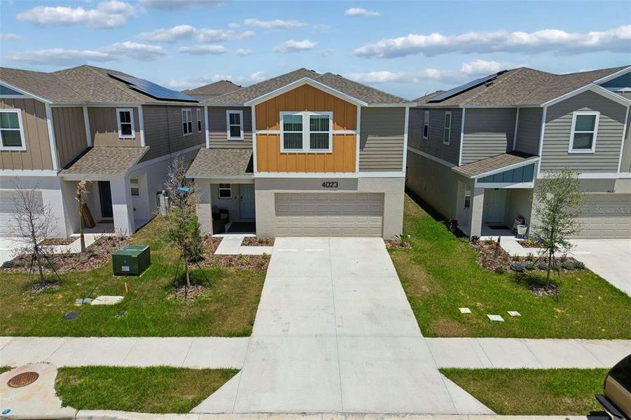 Front exterior of a new home in , Haines City, FL, highlighting curb appeal (Image 23).