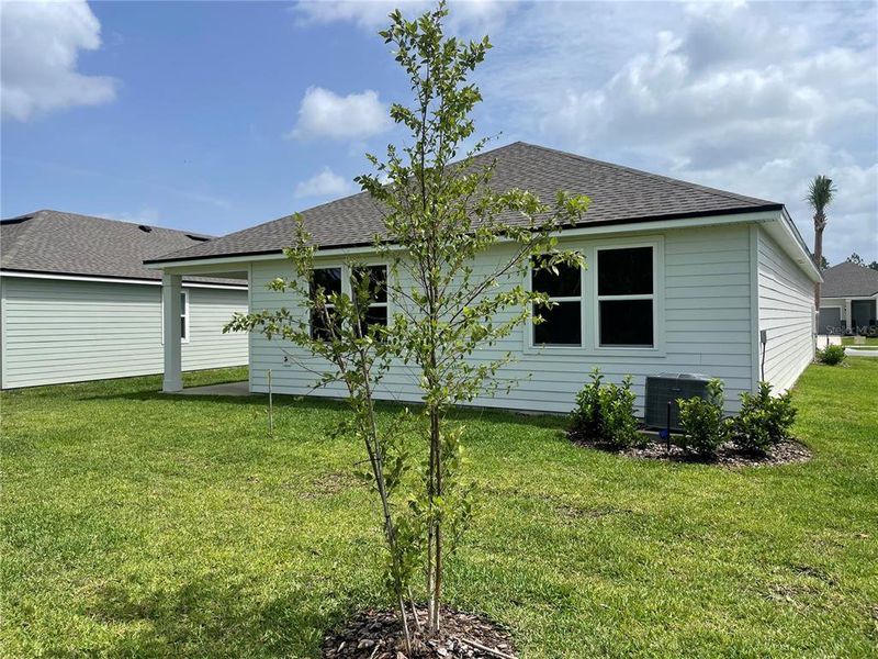 Front exterior of a new home in Magnolia Series at Seminole Palms, Palm Coast, FL, highlighting curb appeal (Image 25).