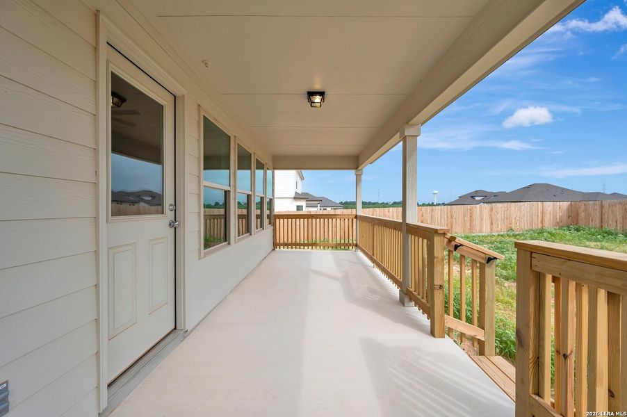 Exterior details and patio area of a home in Hickory Ridge Estates, Elmendorf (Image 3).