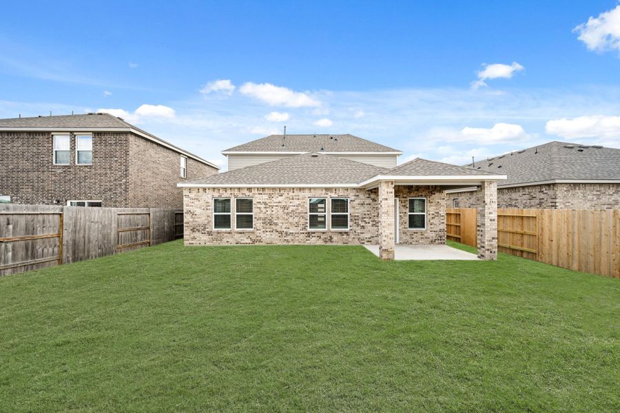 Exterior details and patio area of a home in Sunterra, Katy (Image 3).