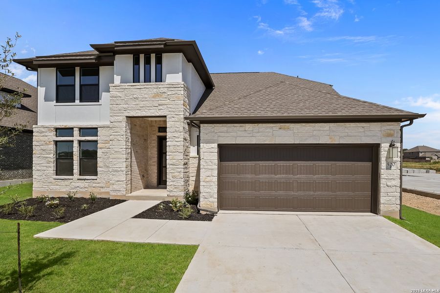 Front exterior of a new home in Buffalo Crossing, Cibolo, TX, highlighting curb appeal (Image 27).