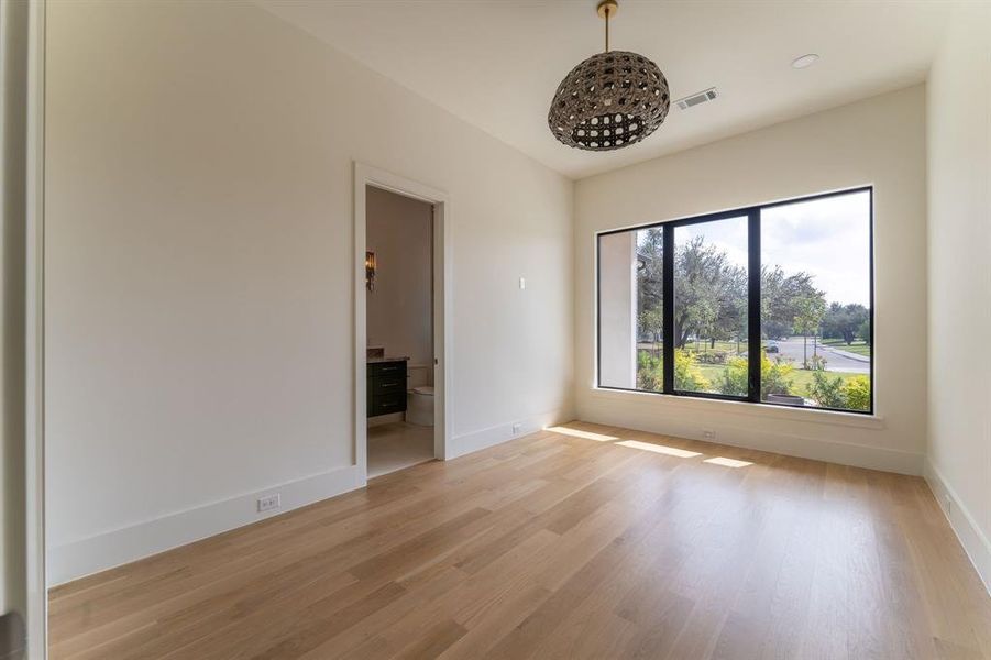 Spare room with light wood finished floors and baseboards