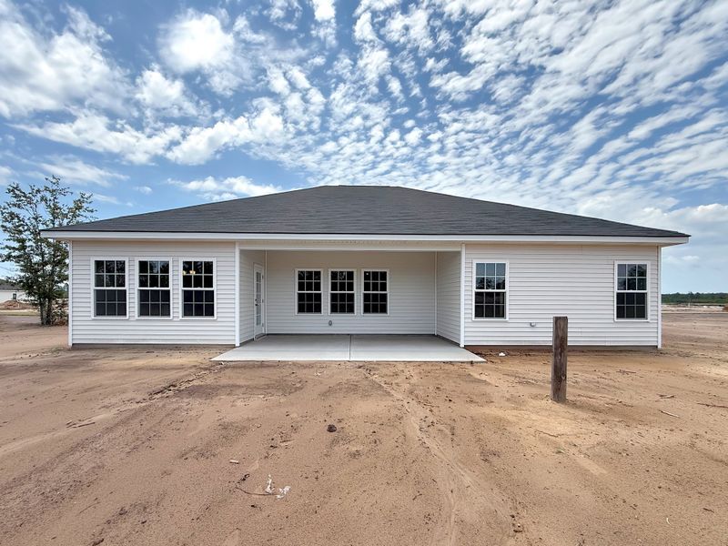 Exterior details and patio area of a home in The Village at Sassafras, Allenhurst (Image 2).