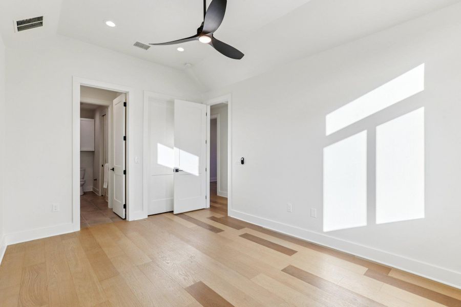 The second level features a spacious guest bedroom that provides essential versatility, making it perfect for a roommate, a secluded home office, or a private suite for visitors