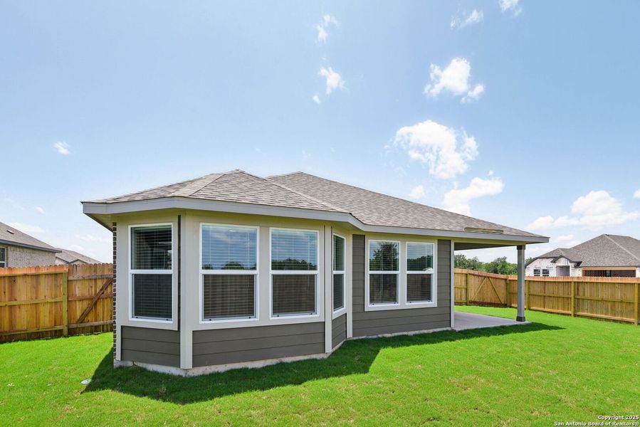 Front exterior of a new home in Carmel Ranch, Schertz, TX, highlighting curb appeal (Image 25). Front exterior of a new home in Carmel Ranch, Schertz, TX, highlighting curb appeal (Image 25).