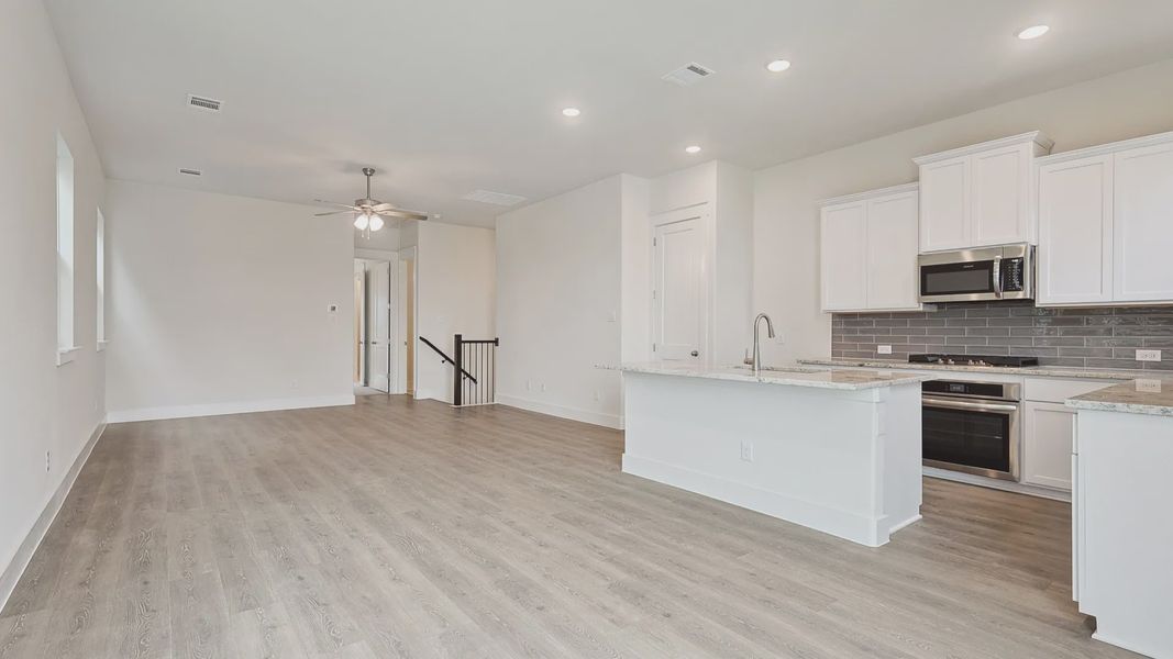 Furnished interior view inside a new home in Collin Creek, Plano (Image 12).