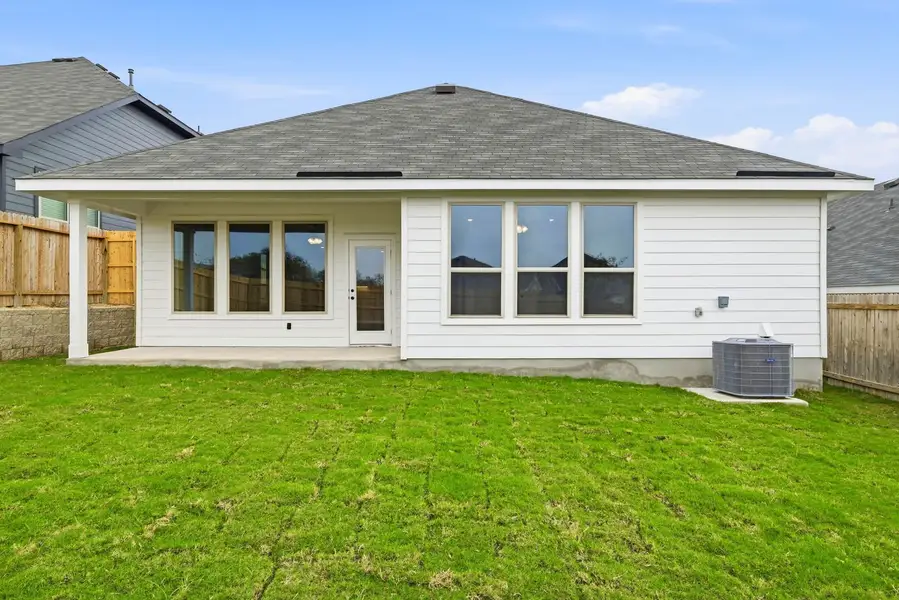 Exterior details and patio area of a home in Seven Oaks Townhomes, Tomball (Image 13). Exterior details and patio area of a home in Seven Oaks Townhomes, Tomball (Image 13).