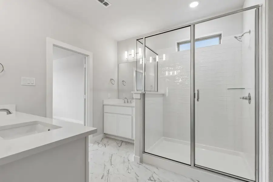 Primary Bathroom in the Winters home plan by Trophy Signature Homes – REPRESENTATIVE PHOTO