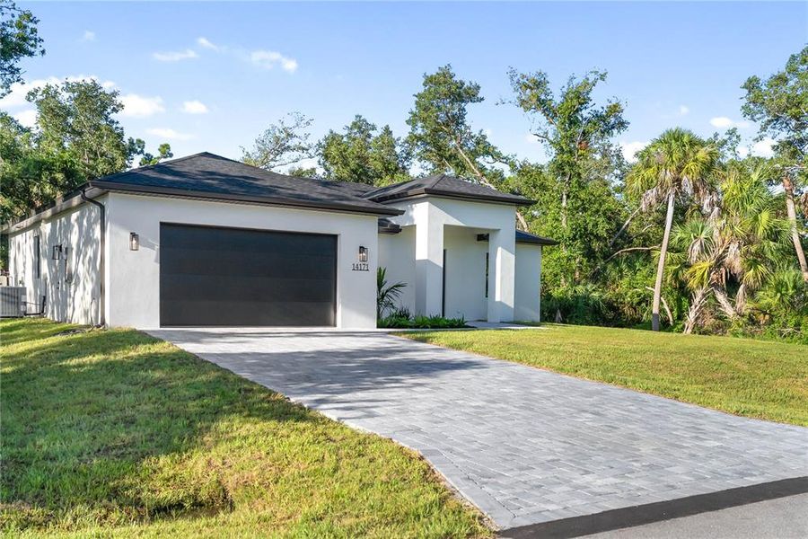 Front exterior of a new home in , Port Charlotte, FL, highlighting curb appeal (Image 30).