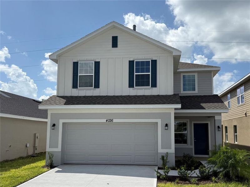 Front exterior of a new home in , St. Cloud, FL, highlighting curb appeal (Image 1).