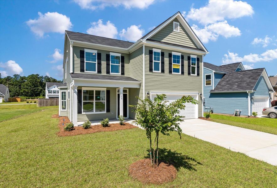 Front exterior of a new home in Oakley Pointe, Moncks Corner, SC, highlighting curb appeal (Image 2). Front exterior of a new home in Oakley Pointe, Moncks Corner, SC, highlighting curb appeal (Image 2).