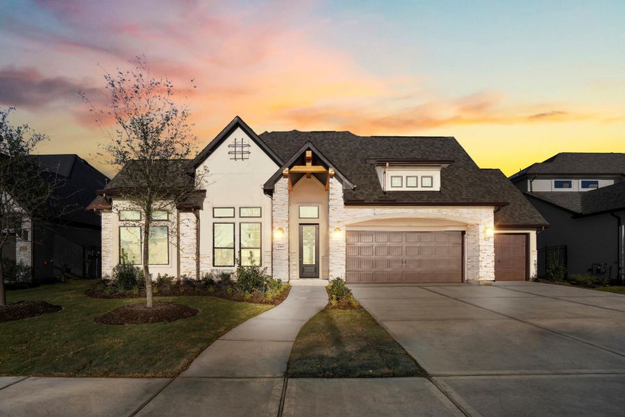 Front exterior of a new home in Jordan Ranch 70' Lots, Fulshear, TX, highlighting curb appeal (Image 2).