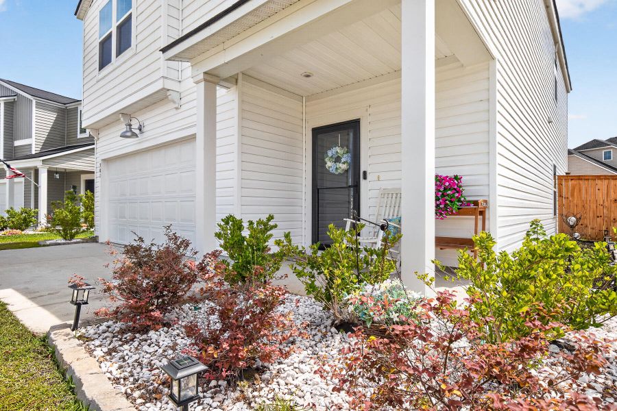Exterior details and patio area of a home in Lindera Preserve at Cane Bay Plantation, Summerville (Image 26).