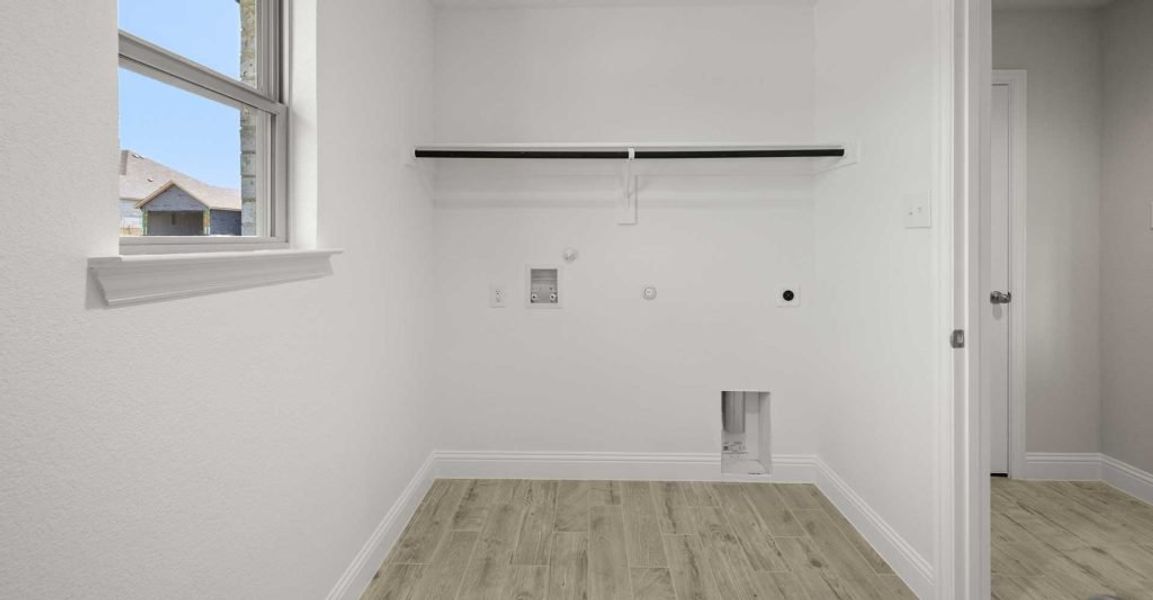 Representative exterior photo of a completed home built from the Alderbury by Impression Homes in Timberbrook, Justin, TX (Image 23).