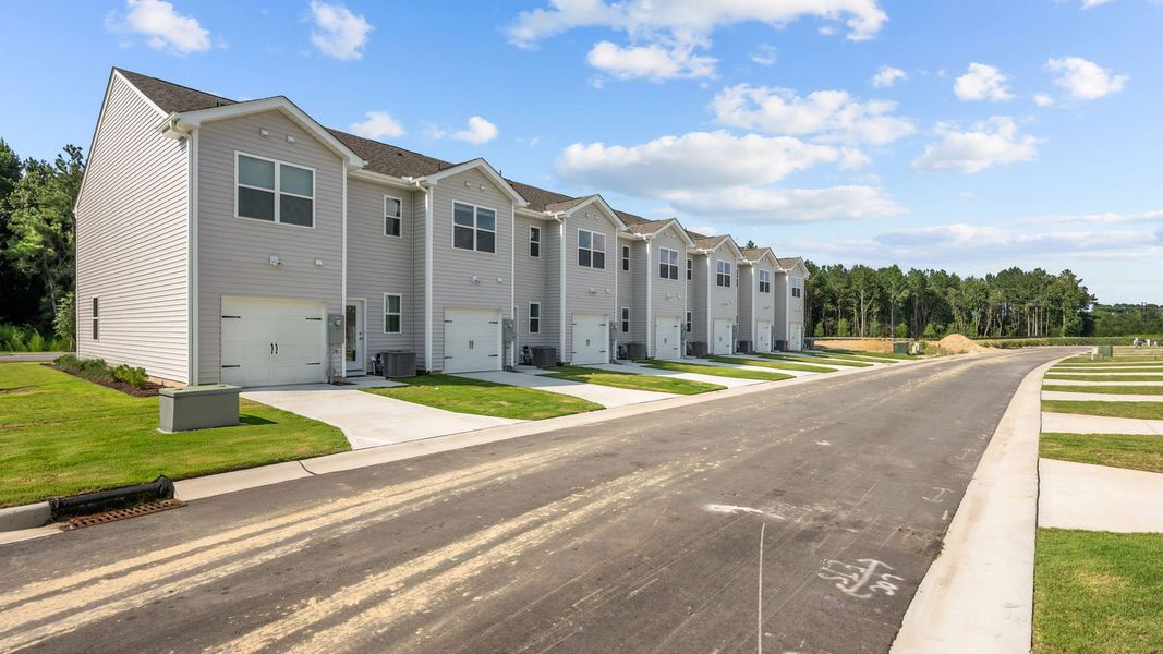 Front exterior of a new home in Clock Road Townhomes, New Bern, NC, highlighting curb appeal (Image 20).