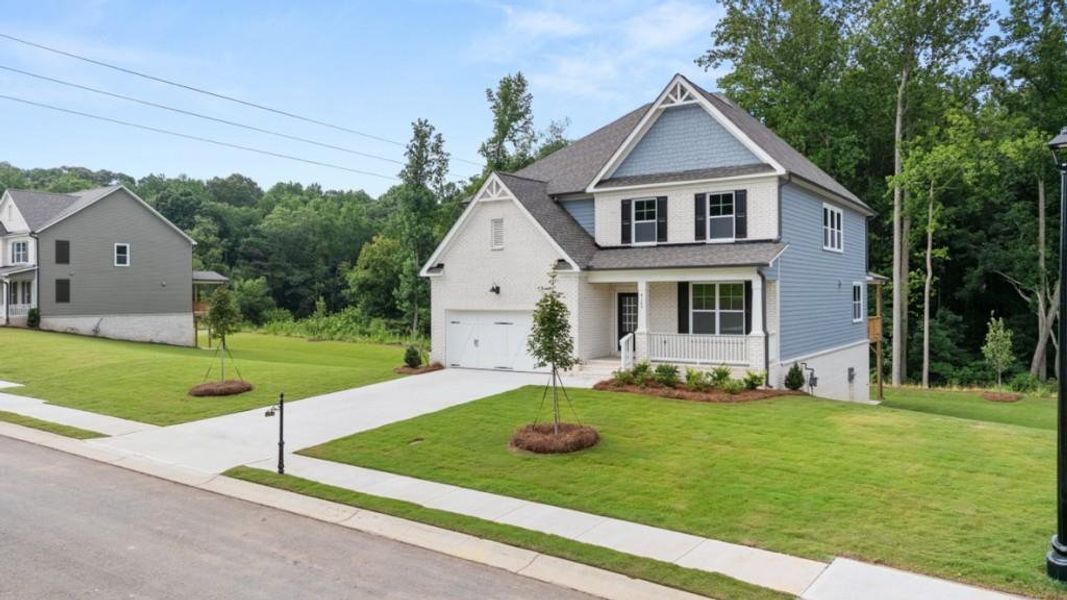 Front exterior of a new home in Haven Abbey, Cumming, GA, highlighting curb appeal (Image 2).