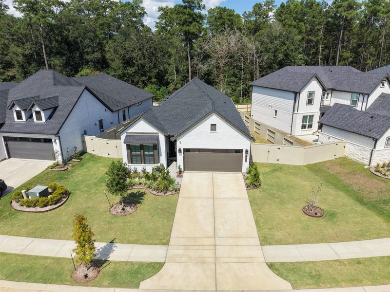 Front exterior of a new home in Audubon - Terrace Collection, Magnolia, TX, highlighting curb appeal (Image 24).