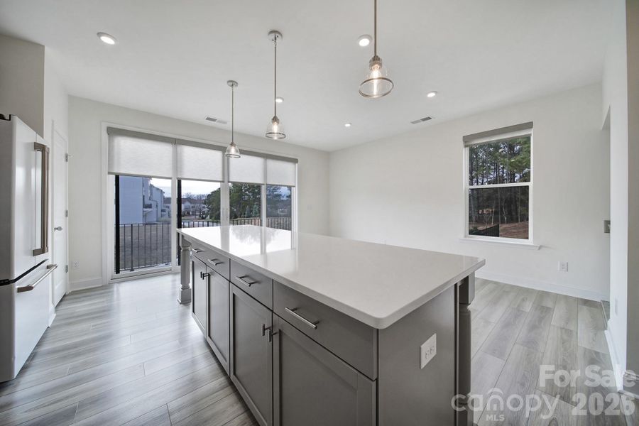Chef's Kitchen - Quartz Countertops, Tile Backsplash, Large Breakfast Bar, Balcony with Double Slider