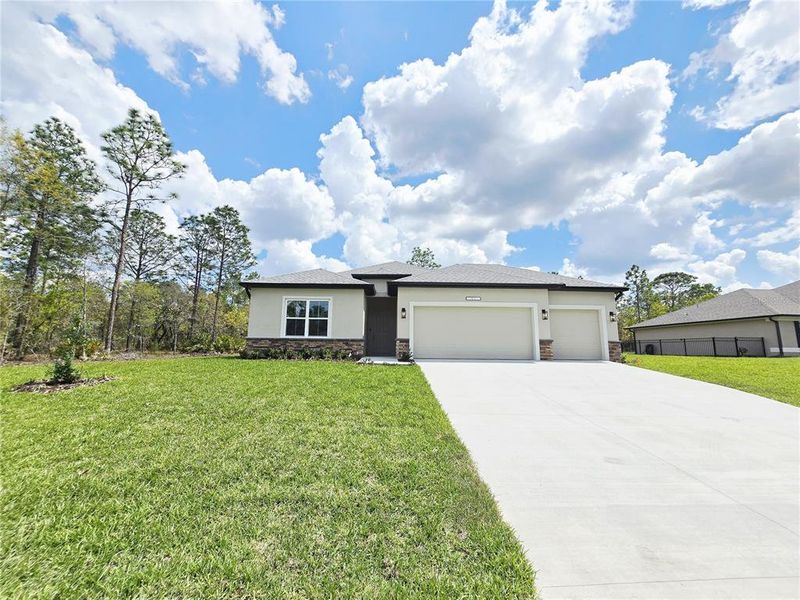 Front exterior of a new home in , Homosassa, FL, highlighting curb appeal (Image 31).