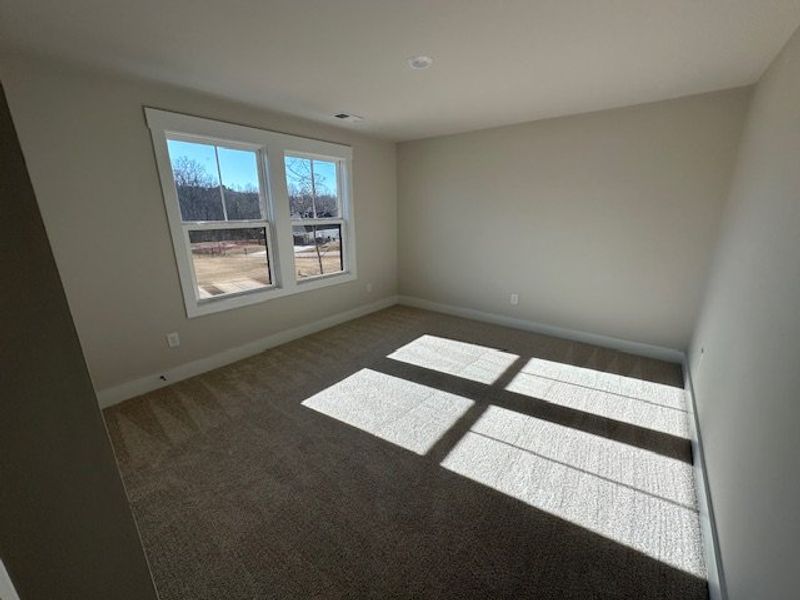 Bright and airy, this room provides a welcoming re