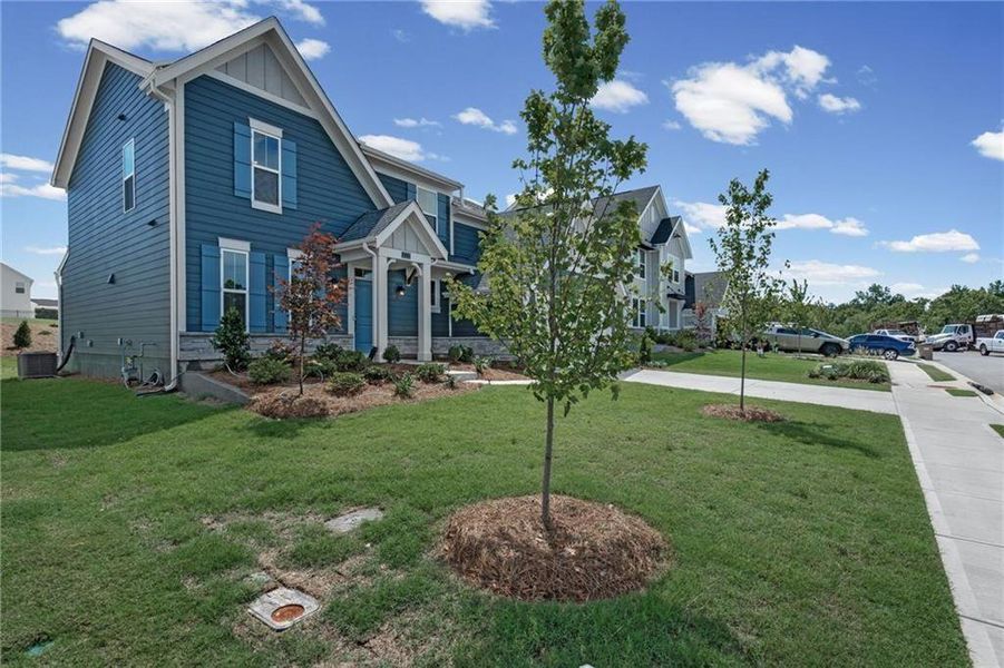 Front exterior of a new home in Twin Lakes, Hoschton, GA, highlighting curb appeal (Image 20).
