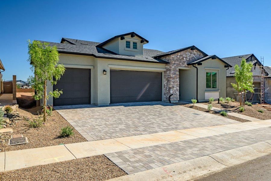 Front exterior of a new home in Horizon at The Dells, Prescott, AZ, highlighting curb appeal (Image 27). Front exterior of a new home in Horizon at The Dells, Prescott, AZ, highlighting curb appeal (Image 27).