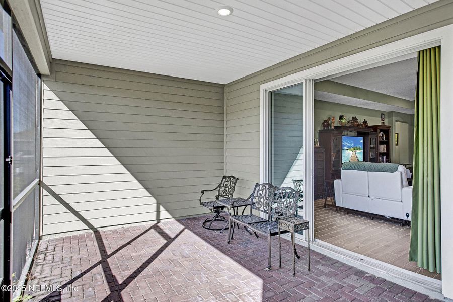 Exterior details and patio area of a home in Tributary: Lakeview at Tributary 60's, Yulee (Image 25).