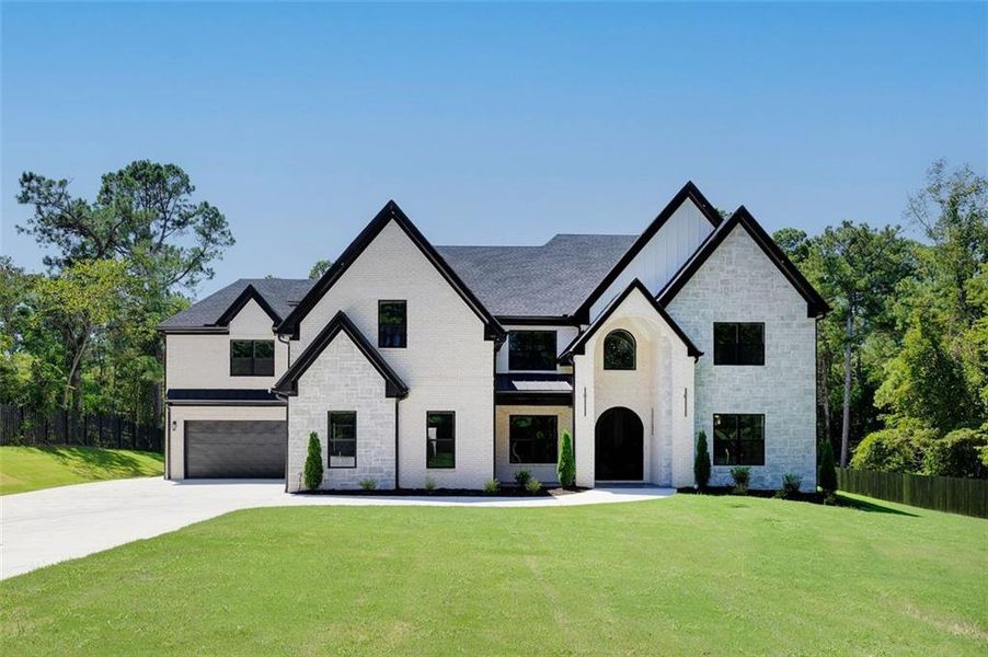 Front exterior of a new home in , Suwanee, GA, highlighting curb appeal (Image 1).