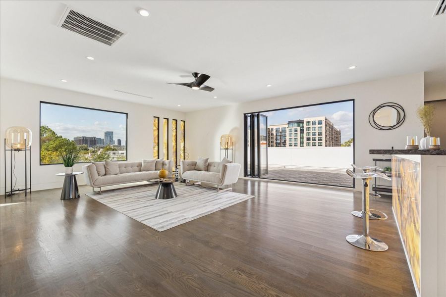 Discover the third floor's exquisite wet bar with exotic onyx, perfect for entertaining against stunning views.