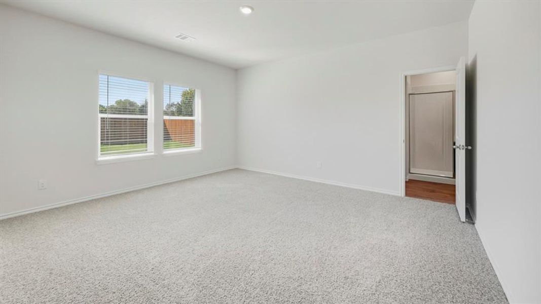 Unfurnished room with carpet floors and recessed lighting
