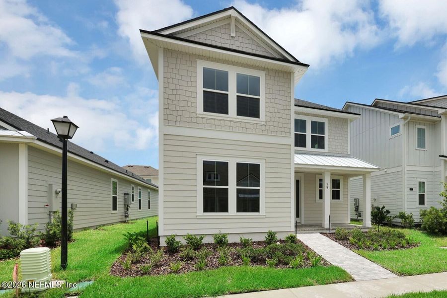 Front exterior of a new home in Seabrook Village at Seabrook, Nocatee, FL, highlighting curb appeal (Image 20).