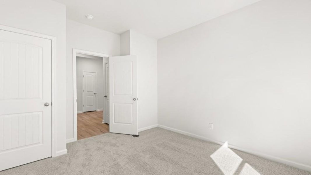 Spacious, unfurnished interior of a new home in South Wind, Fairburn (Image 25).