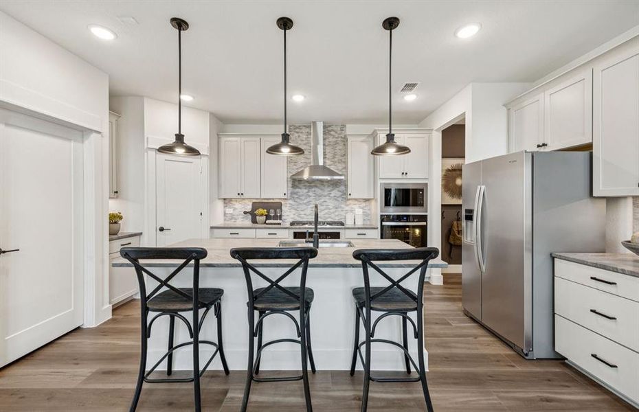 *Model Representation - Spacious kitchen with eat-in bartop island
