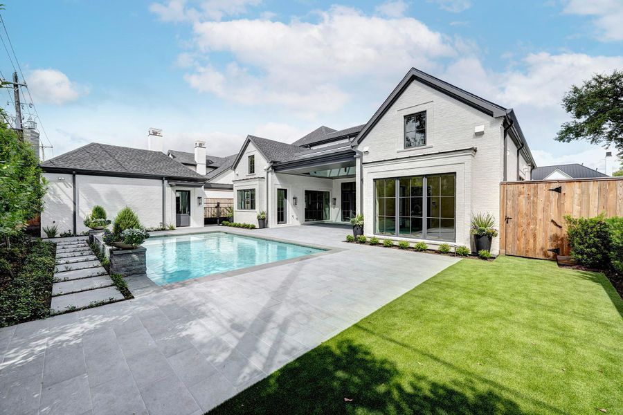 Behind the wood fence gate is a whole home generator.  Not shown on the fence on the right is fragrant star jasmine.