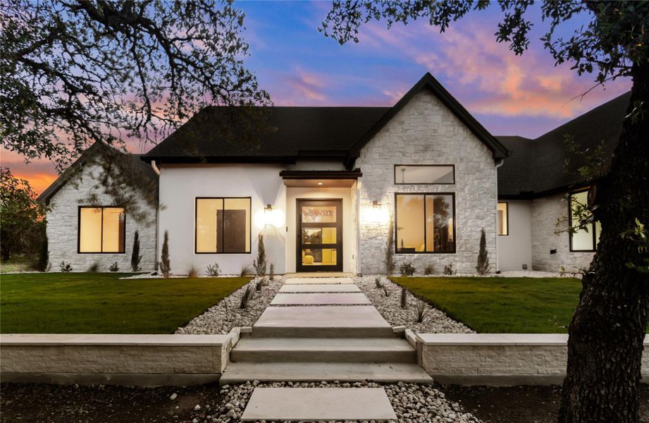 Front exterior of a new home in , Dripping Springs, TX, highlighting curb appeal (Image 20). Front exterior of a new home in , Dripping Springs, TX, highlighting curb appeal (Image 20).