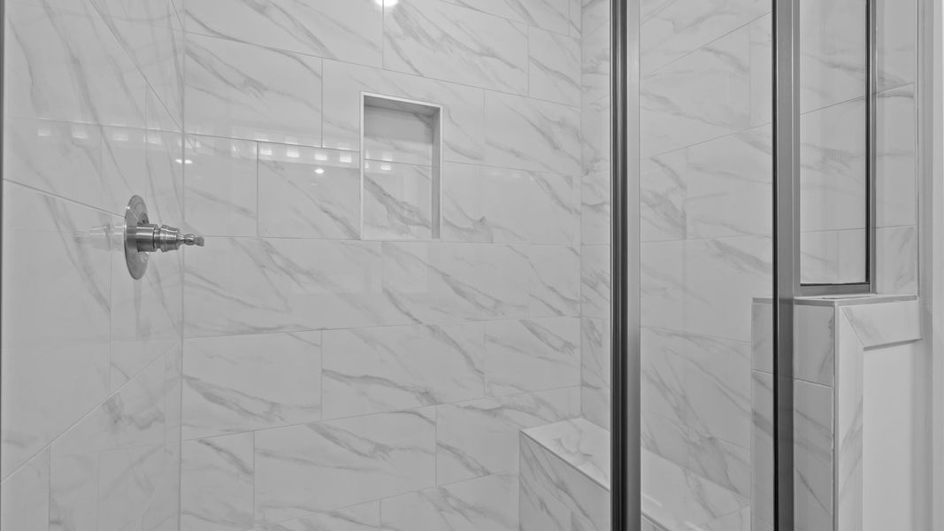 Superior en-suite primary bathroom with stylish dual vanity and walk-in shower—crafted with high standards in mind Superior en-suite primary bathroom with stylish dual vanity and walk-in shower—crafted with high standards in mind