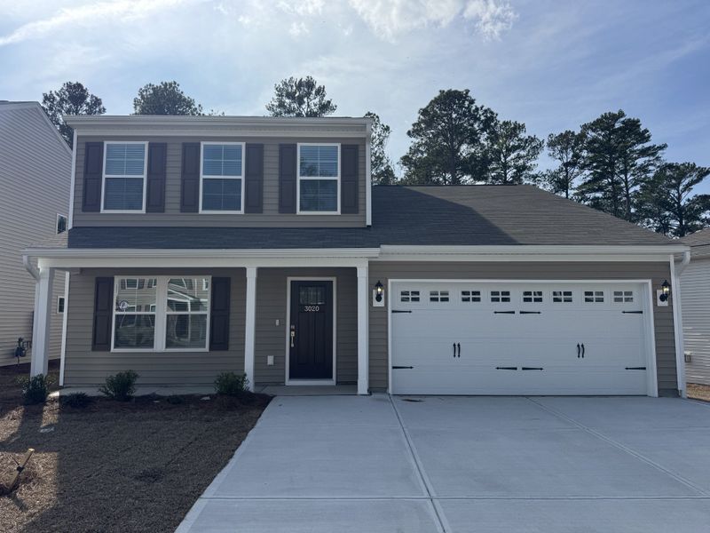 Front exterior of a new home in Ellington, Elgin, SC, highlighting curb appeal (Image 1). Front exterior of a new home in Ellington, Elgin, SC, highlighting curb appeal (Image 1).
