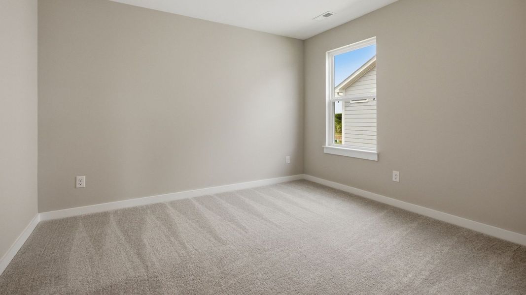 Bedroom with carpet and windows Bedroom with carpet and windows