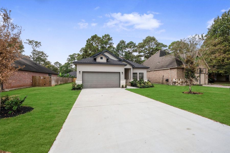 Front exterior of a new home in , Montgomery, TX, highlighting curb appeal (Image 26). Front exterior of a new home in , Montgomery, TX, highlighting curb appeal (Image 26).