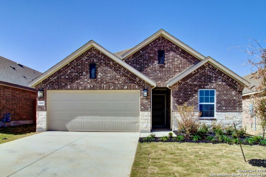 Front exterior of a new home in Clear Creek, New Braunfels, TX, highlighting curb appeal (Image 1).